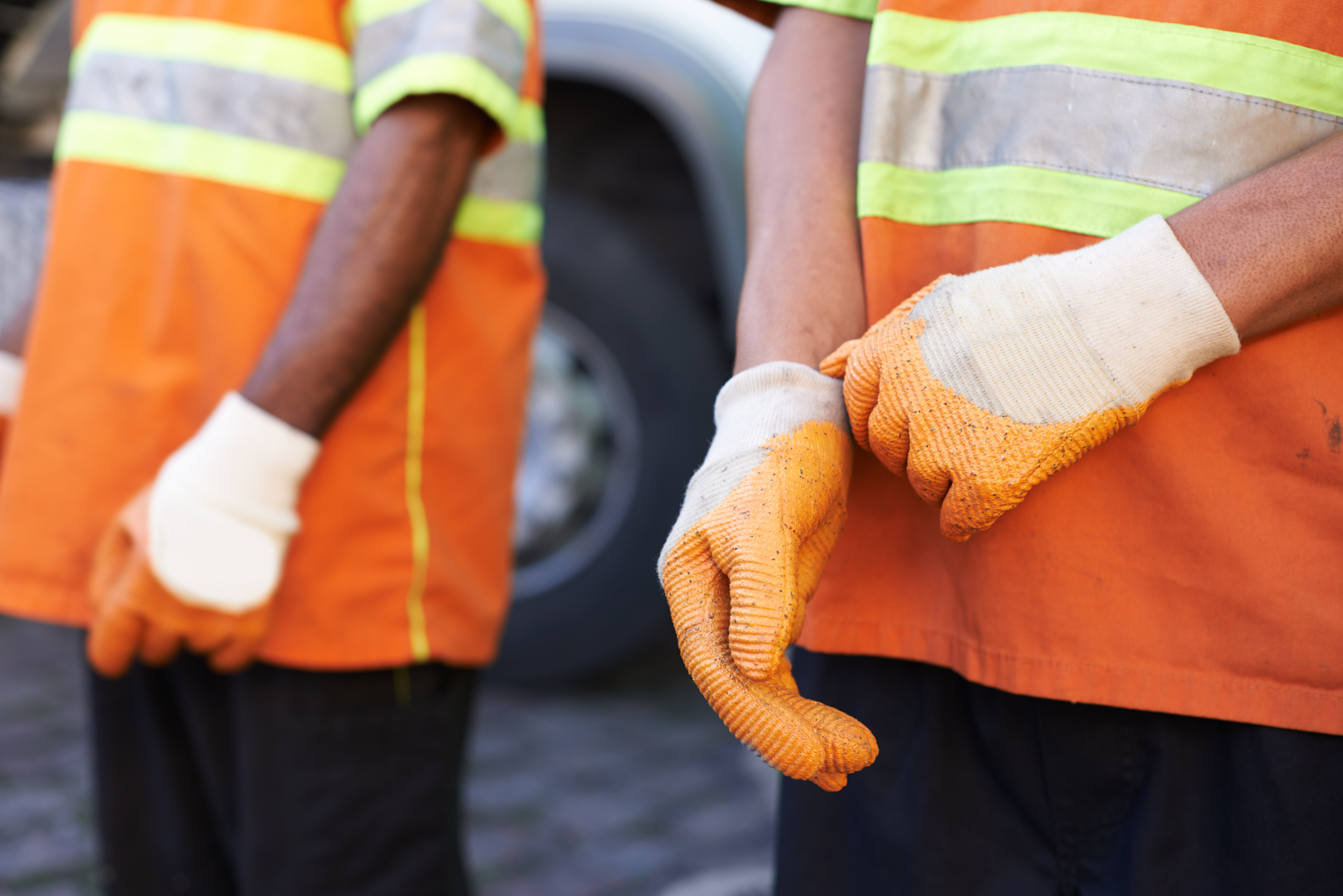 Keeping the city clean. Cropped shot of a team of garbage collectors.